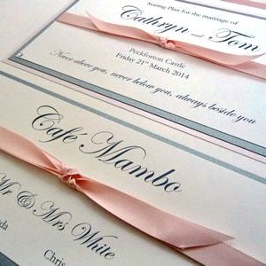 Pink and Silver Wedding Table Plan with knotted ribbon