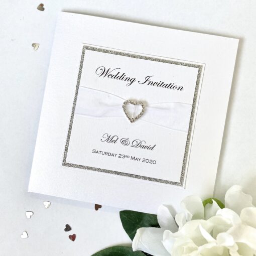 Crisp white and glitter pocketfold invitation with buckle