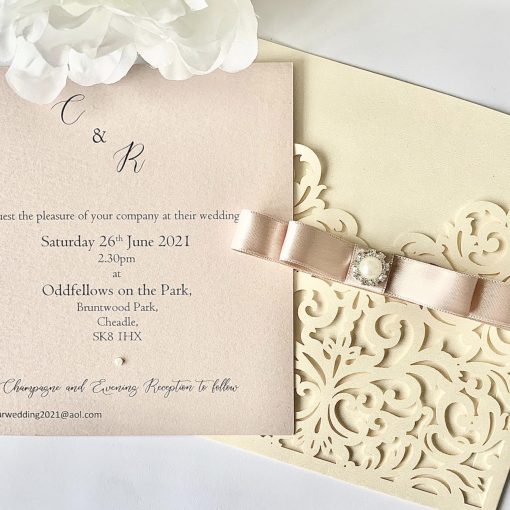 Luxury Ivory Laser cut invitation with double satin dior bow and pearl embelishment