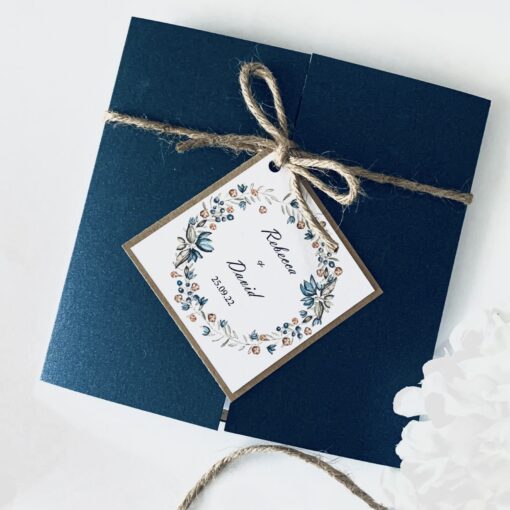 navy gatefold with rustic wreath plaque