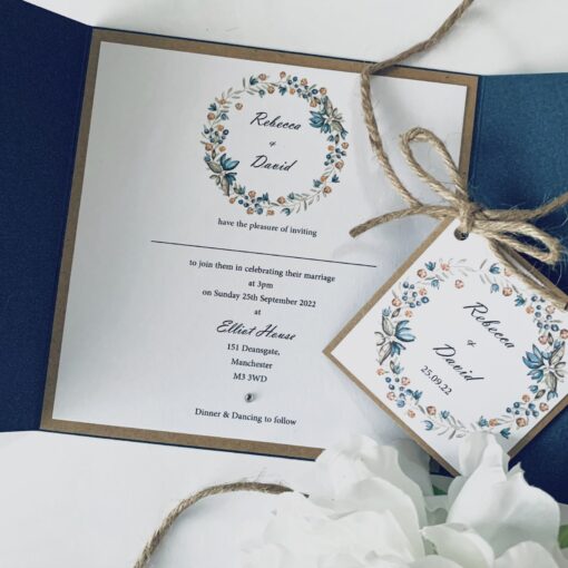 navy gatefold with rustic wreath plaque