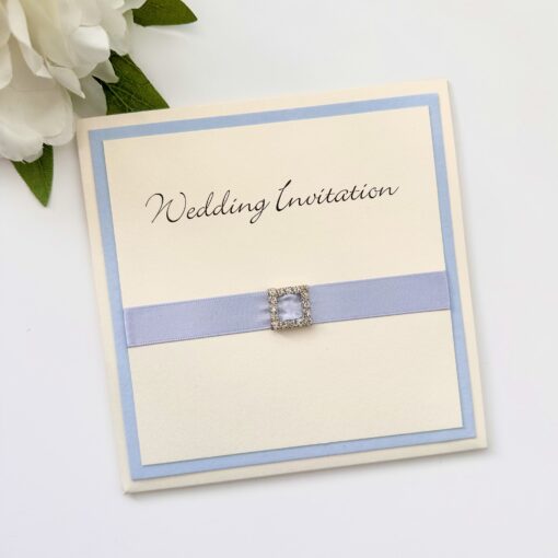 wedding invitation with blue ribbon