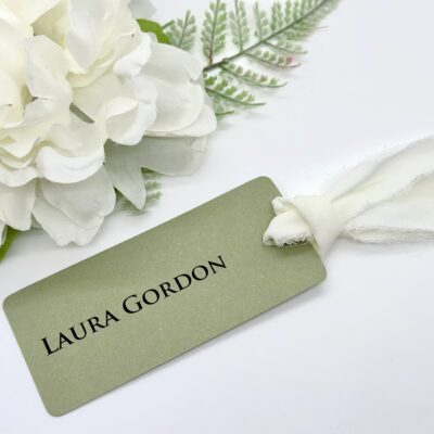 Green Tag Name place card with frayed ribbon